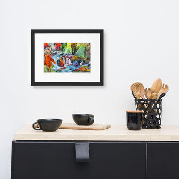 Framed forest poster adding elegance to a modern kitchen decor with black dishes and wooden utensils.